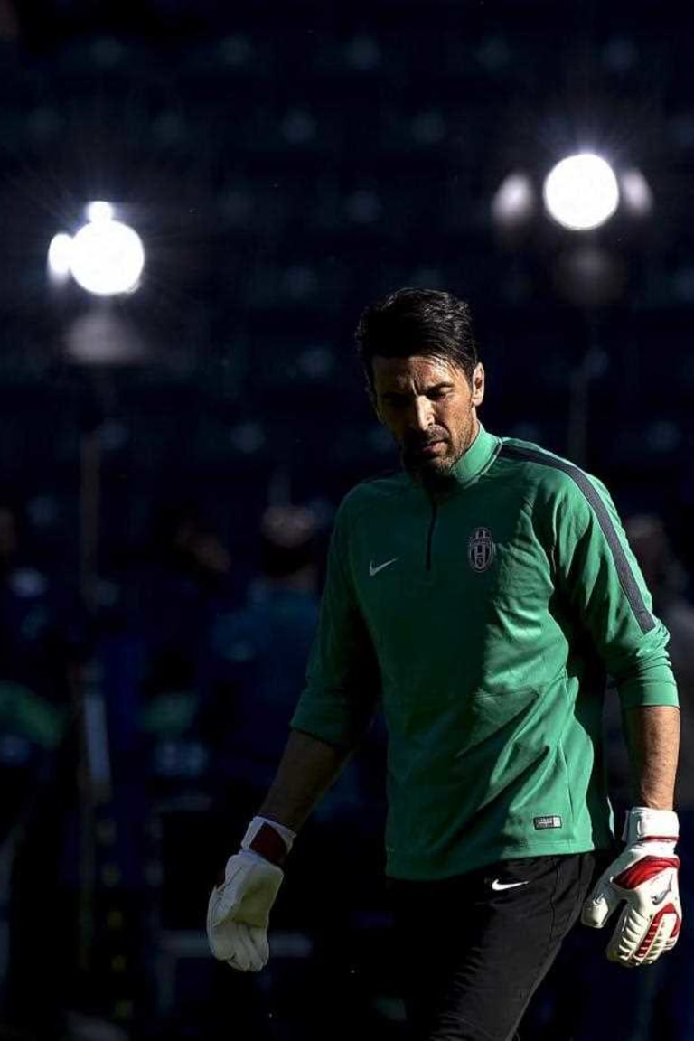 Buffon penalty heroics bag Italy a point